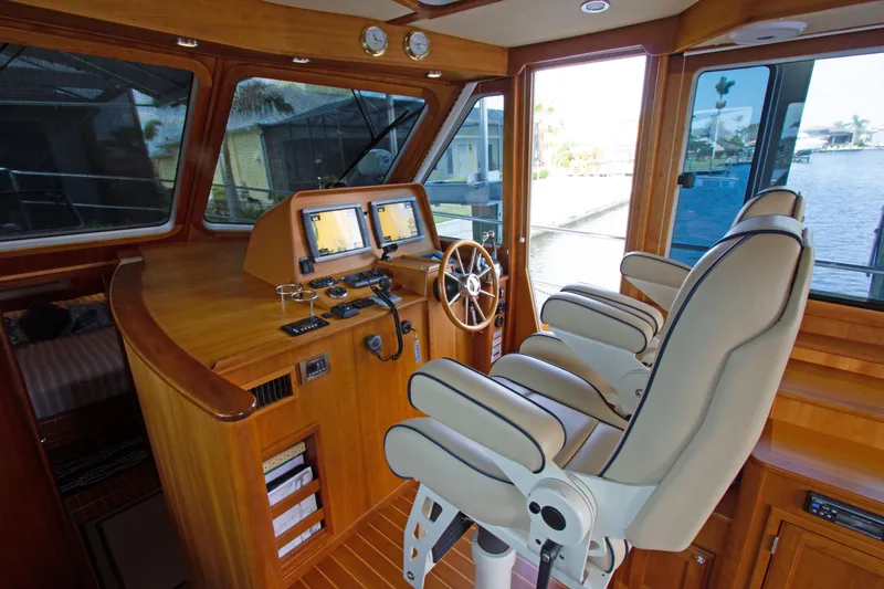 Slide: The Image of Interior helm of 2010 Sabre 40 Hardback Express yacht with dual captain chairs and navigation screens. - 19