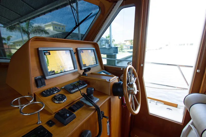 Slide: The Image of Interior helm of 2010 Sabre 40 Hardback Express with dual navigation screens. - 20