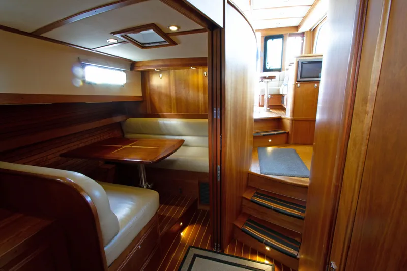 Slide: The Image of Interior of 2010 Sabre 40 Hardback Express yacht with dining area and wooden finishes. - 23