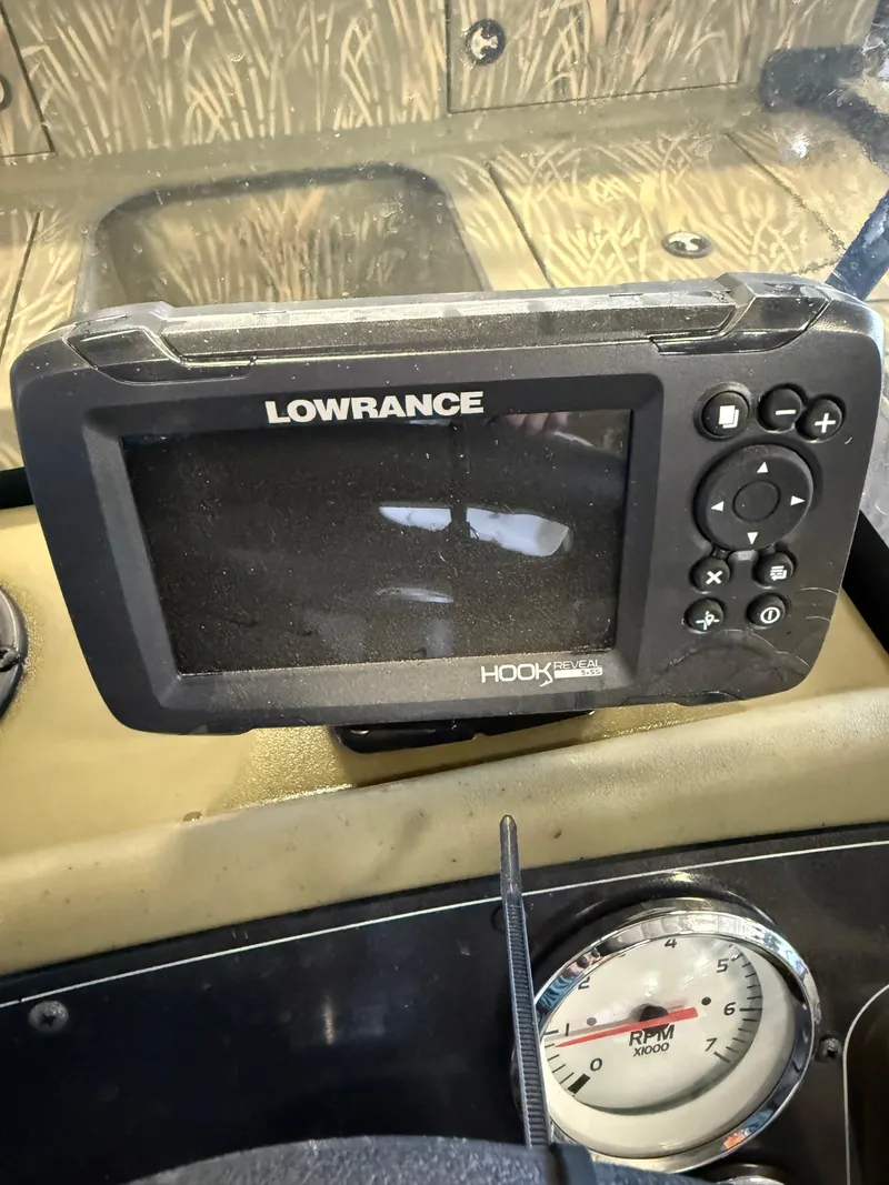Slide: The Image of Lowrance Hook fish finder on 2023 Tracker Grizzly 2072 CC Sportsman dashboard. - 11