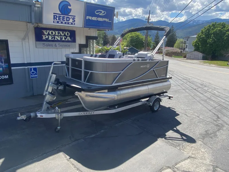Slide: The Image of 2023 Godfrey MIGHTY G 1476C pontoon boat on trailer at Reed's Marine. - 1