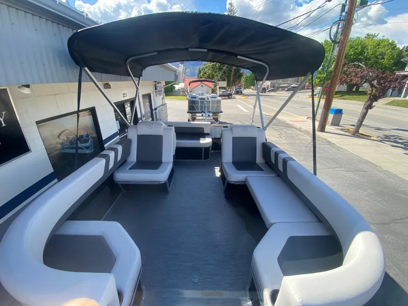 Slide: The Image of 2023 Godfrey MIGHTY G 1476C pontoon boat with spacious seating and canopy. - 2