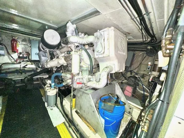 Slide: The Image of Engine room of a 1978 Jones-Goodell Pilothouse boat with visible machinery. - 29