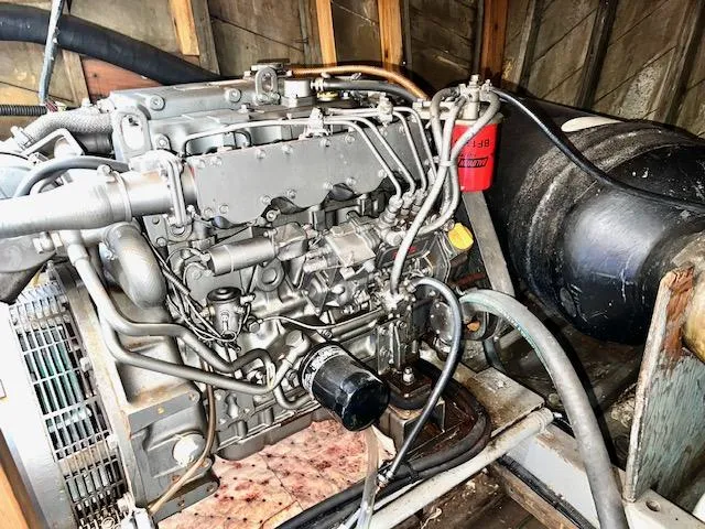 Slide: The Image of 1978 Jones-Goodell Pilothouse engine in a wooden compartment - 37