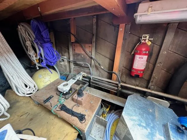 Slide: The Image of 1978 Jones-Goodell Pilothouse interior with ropes, fire extinguisher, and equipment. - 38