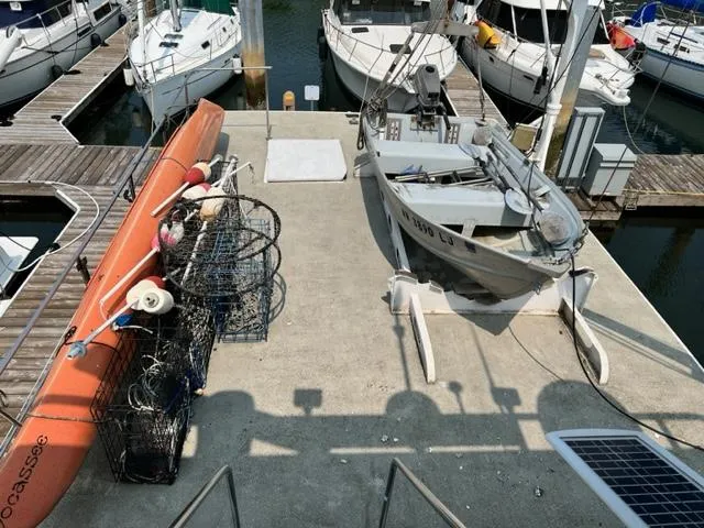 Slide: The Image of 1978 Jones-Goodell Pilothouse docked with fishing gear and kayak. - 7