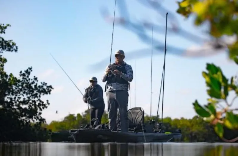 Slide: The Image of Two anglers fishing on a 2023 Native Watercraft SLAYER PROPEL 10 MAX kayak. - 3