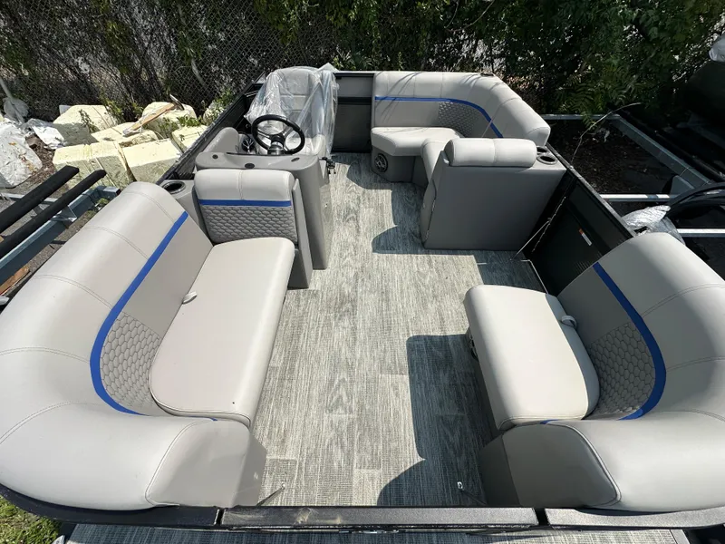 Slide: The Image of 2023 Qwest NEW 816 Lanai LT (XF16) pontoon boat interior with gray seating and steering console. - 10