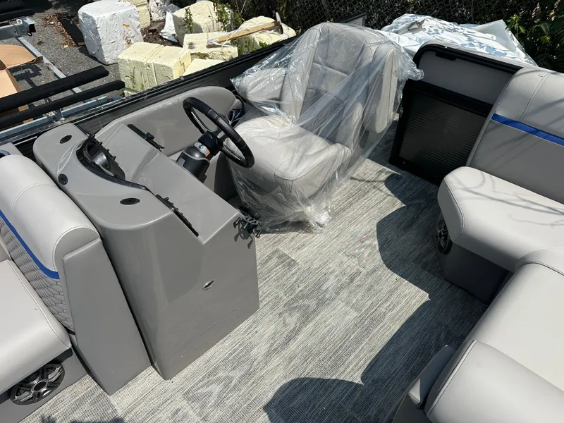 Slide: The Image of 2023 Qwest NEW 816 Lanai LT boat interior with gray seating and steering console. - 7