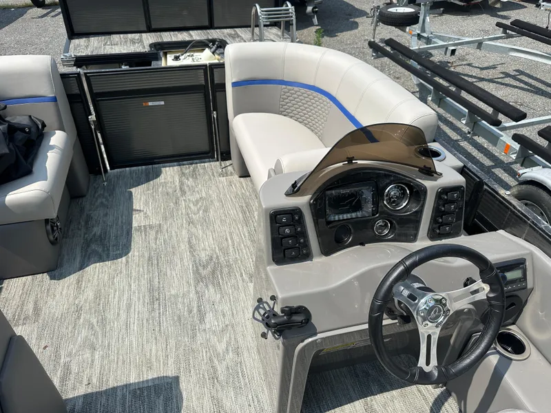 Slide: The Image of 2023 Qwest NEW 816 Lanai LT boat interior with steering console and seating. - 8