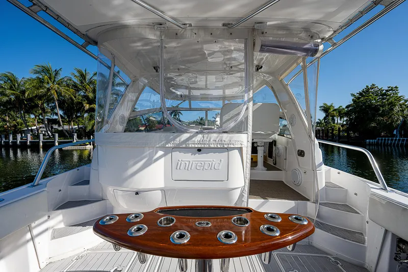 Slide: The Image of 2014 Intrepid 475 Sport Yacht interior with sleek design and polished wood accents. - 10