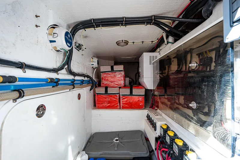 Slide: The Image of Engine room of 2014 Intrepid 475 Sport Yacht with batteries and wiring. - 12