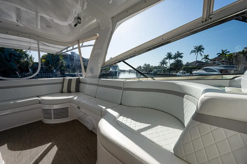 Slide: The Image of Luxurious interior of 2014 Intrepid 475 Sport Yacht with plush seating and scenic view. - 16