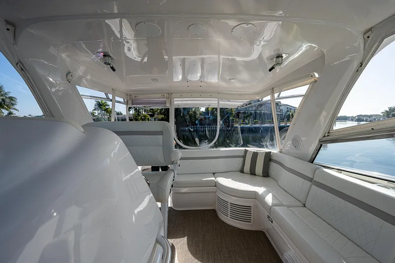 Slide: The Image of Interior of 2014 Intrepid 475 Sport Yacht with spacious seating and panoramic windows. - 17
