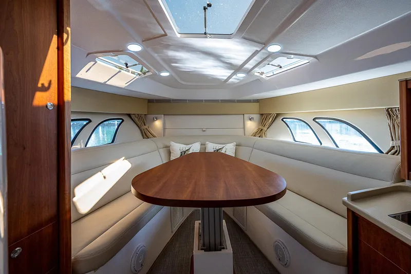 Slide: The Image of Luxurious interior of 2014 Intrepid 475 Sport Yacht with elegant seating and skylights. - 27
