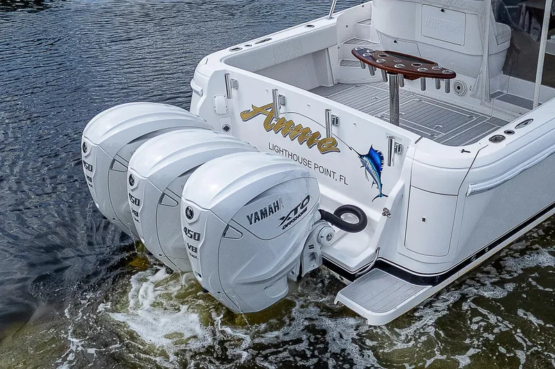 Slide: The Image of 2014 Intrepid 475 Sport Yacht with triple Yamaha 350 engines on water. - 3