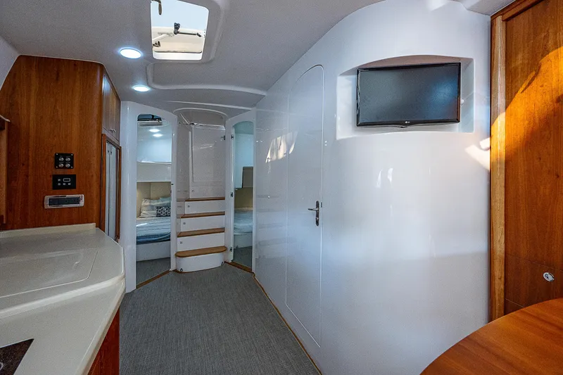 Slide: The Image of Interior of 2014 Intrepid 475 Sport Yacht, featuring modern design and cozy living space. - 34