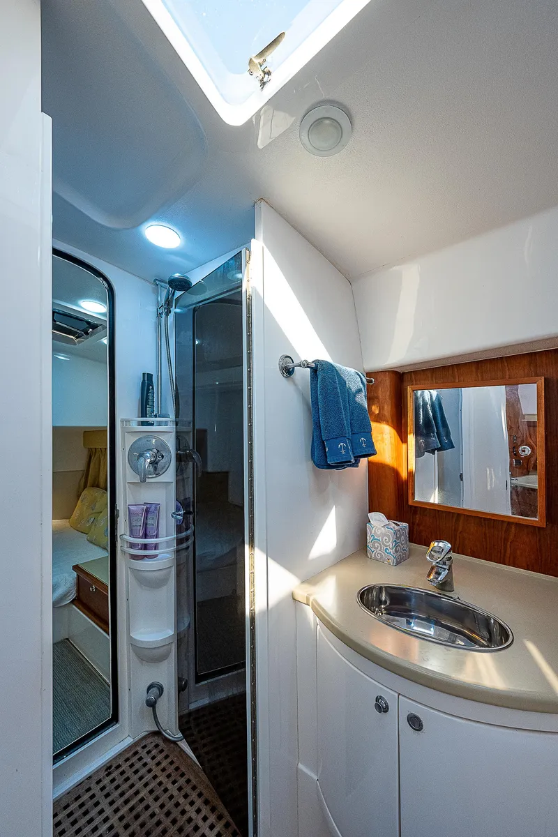 Slide: The Image of Luxurious bathroom in 2014 Intrepid 475 Sport Yacht with modern fixtures and natural lighting. - 43