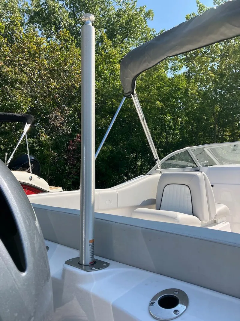 Slide: The Image of 2023 Sea Fox 226 Traveler boat interior with seating and canopy. - 16