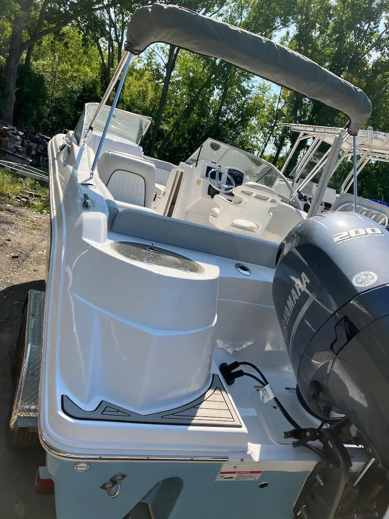 Slide: The Image of 2023 Sea Fox 226 Traveler boat with Yamaha 200 engine, docked outdoors. - 17