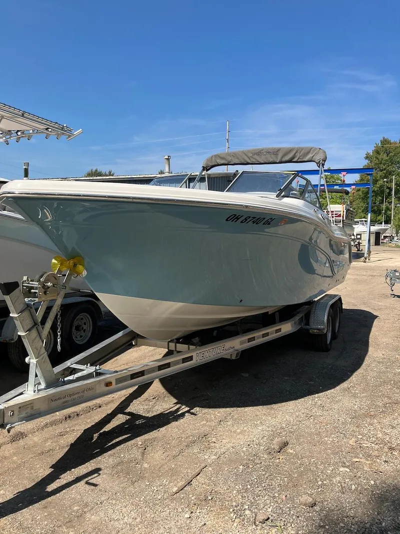 Slide: The Image of 2023 Sea Fox 226 Traveler boat on a trailer in a sunny outdoor setting. - 18