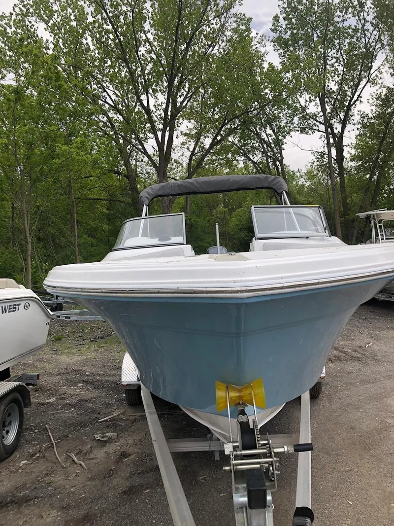 Slide: The Image of 2023 Sea Fox 226 Traveler boat on trailer in outdoor setting. - 2