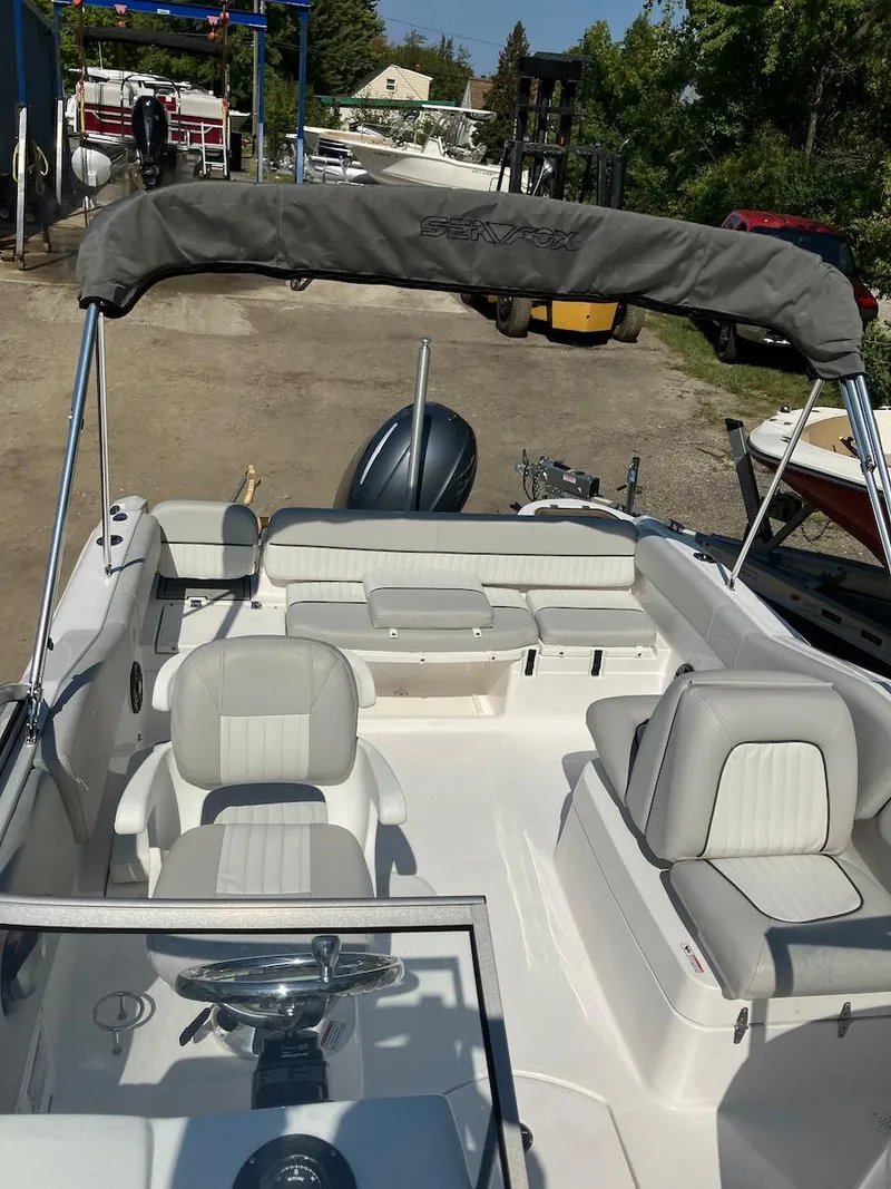 Slide: The Image of 2023 Sea Fox 226 Traveler boat interior with seating and canopy. - 25