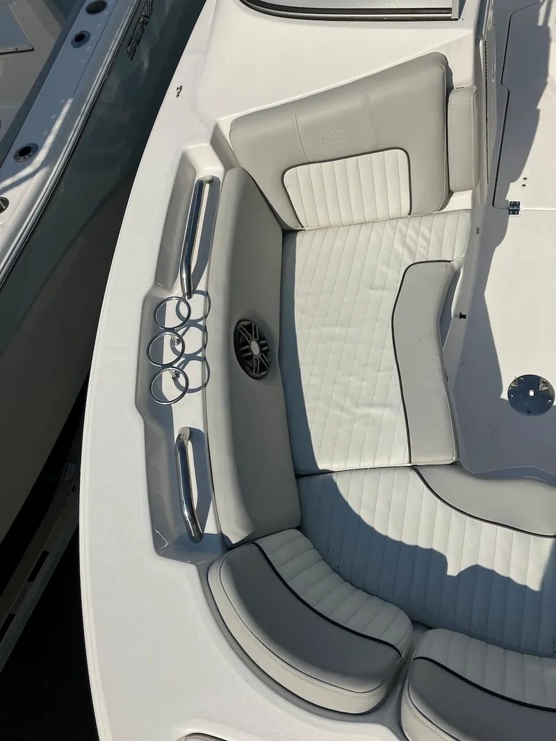 Slide: The Image of 2023 Sea Fox 226 Traveler boat interior with cushioned seating and cup holders. - 28