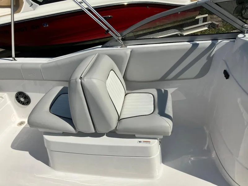 Slide: The Image of 2023 Sea Fox 226 Traveler boat with gray and white cushioned seating. - 31