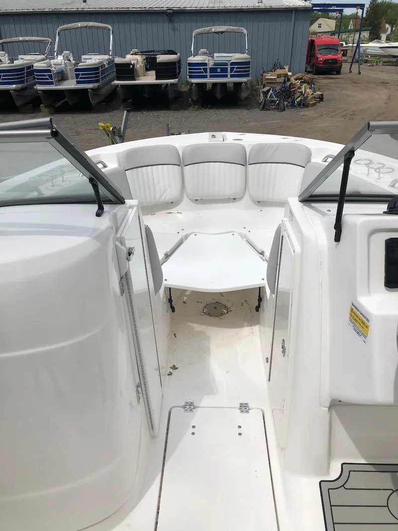 Slide: The Image of 2023 Sea Fox 226 Traveler boat interior with white seating and open deck. - 7