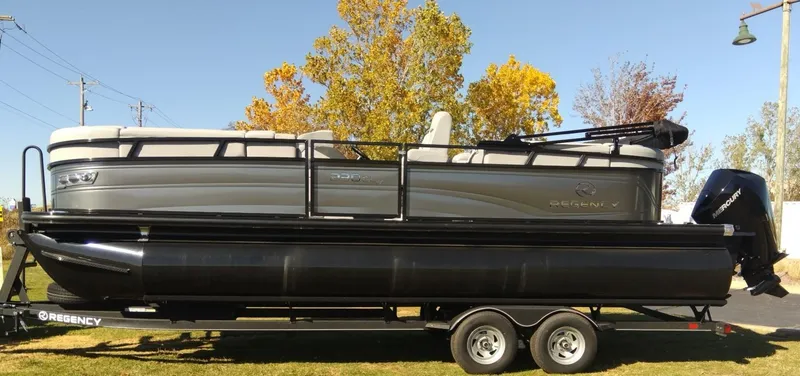 Slide: The Image of 2023 Regency 230 DL3 pontoon boat on trailer, side view. - 0