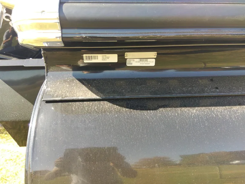 Slide: The Image of Close-up of a 2023 Regency 230 DL3 boat's identification labels. - 8