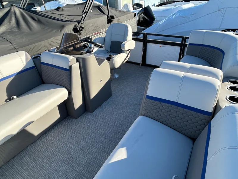 Slide: The Image of 2023 Qwest 814 CTR Cruise boat interior with gray seating and blue accents. - 2