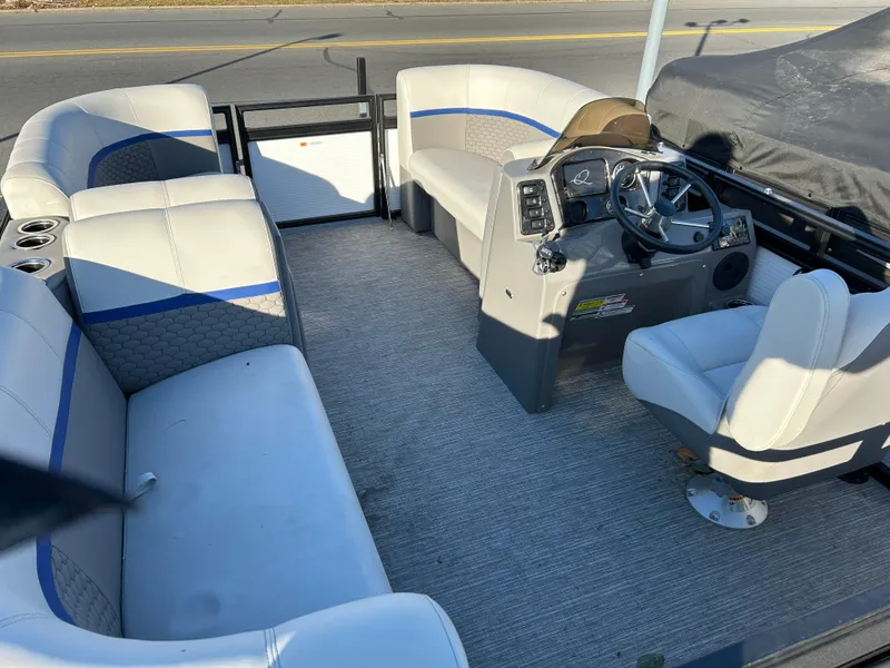 Slide: The Image of 2023 Qwest 814 CTR Cruise boat interior with seating and steering console. - 6