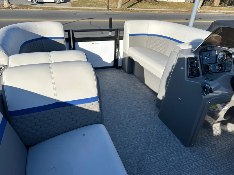 Slide: The Image of 2023 Qwest 814 CTR Cruise boat interior with gray and blue seating. - 7