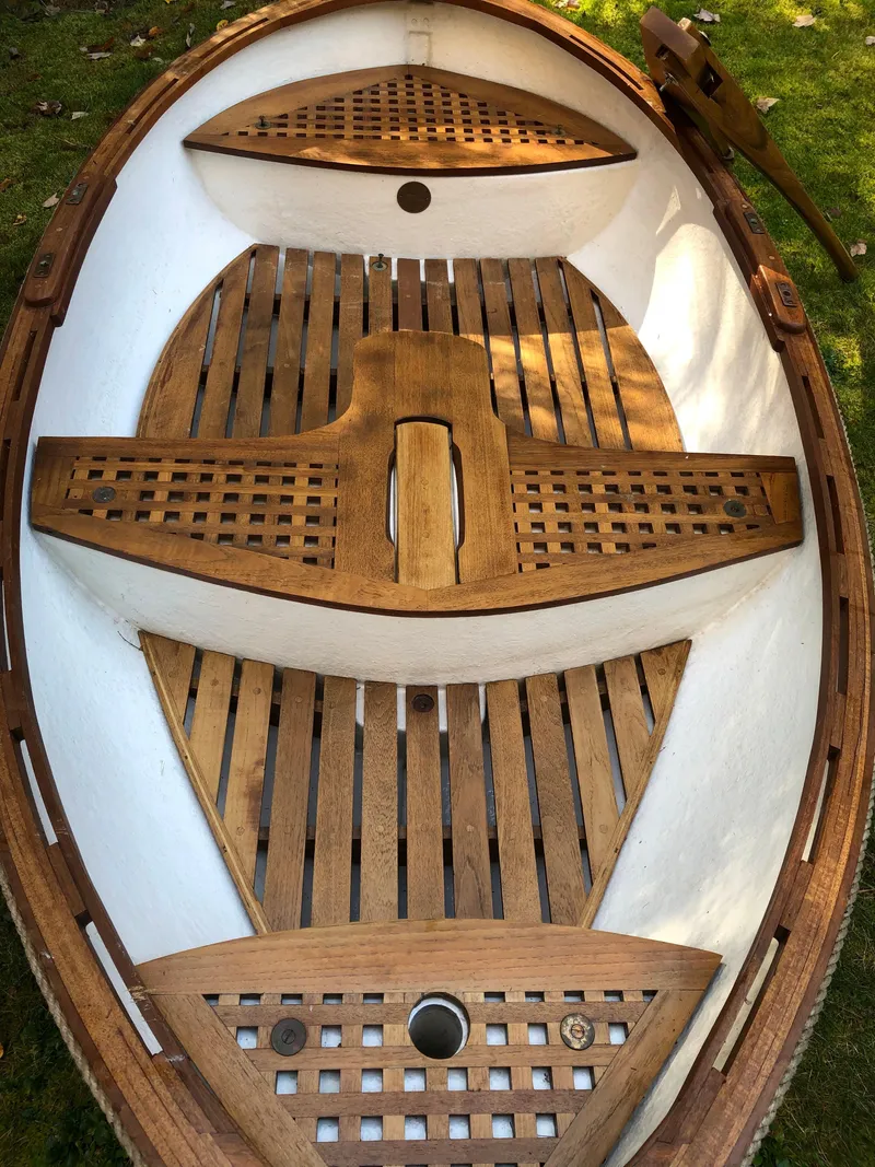 Slide: The Image of 1980 Tender Perrywinckle boat with wooden slatted interior, viewed from above. - 1