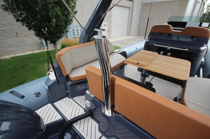 Slide: The Image of 2024 Zodiac MEDLINE 9 NEO Twin 300hp boat interior with seating and table. - 11