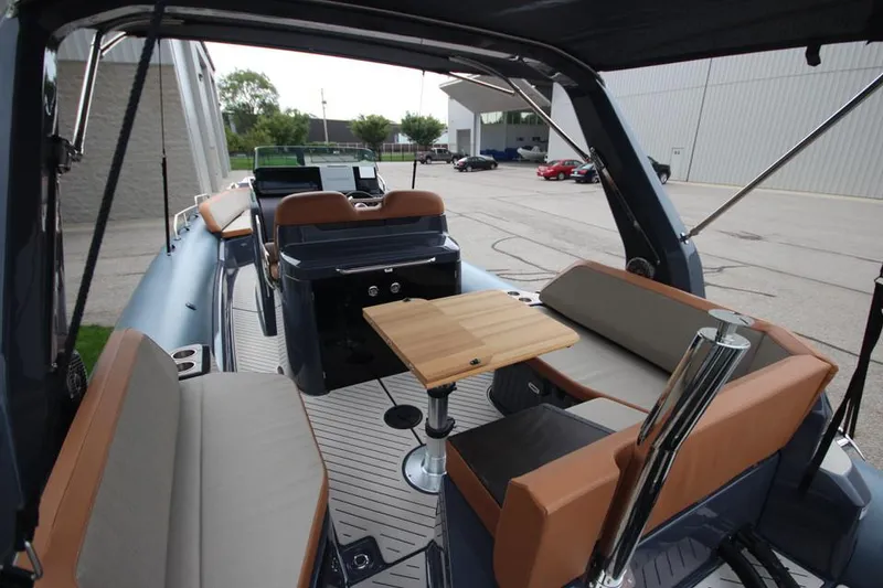 Slide: The Image of 2024 Zodiac MEDLINE 9 NEO Twin 300hp boat interior with seating and table. - 12