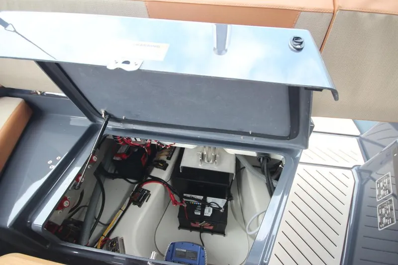 Slide: The Image of 2024 Zodiac MEDLINE 9 NEO Twin 300hp boat storage compartment with electrical components. - 15