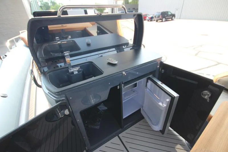 Slide: The Image of 2024 Zodiac MEDLINE 9 NEO Twin 300hp boat with open kitchenette and mini fridge. - 21