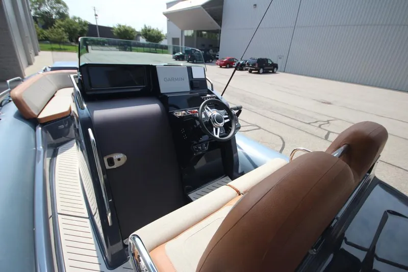 Slide: The Image of 2024 Zodiac MEDLINE 9 NEO Twin 300hp boat interior with steering console and seating. - 22