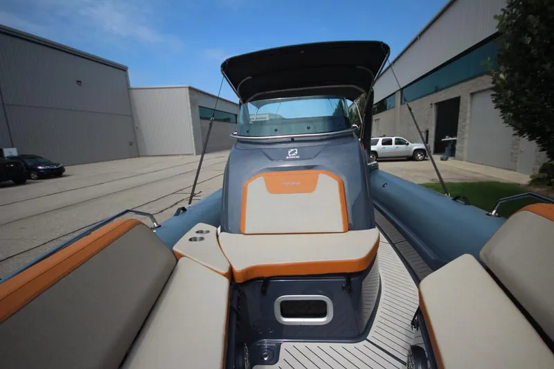 Slide: The Image of 2024 Zodiac MEDLINE 9 NEO Twin 300hp boat, docked near industrial buildings. - 30