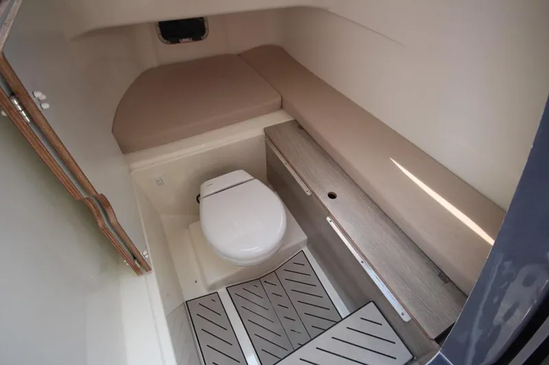 Slide: The Image of 2024 Zodiac MEDLINE 9 NEO Twin 300hp boat interior with toilet and seating area. - 38