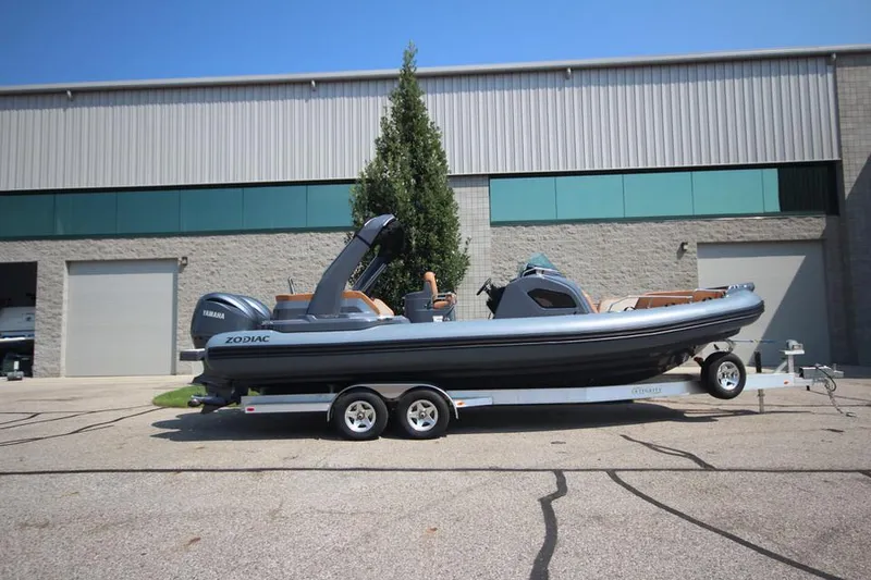 Slide: The Image of 2024 Zodiac MEDLINE 9 NEO Twin 300hp boat on trailer outside warehouse. - 7