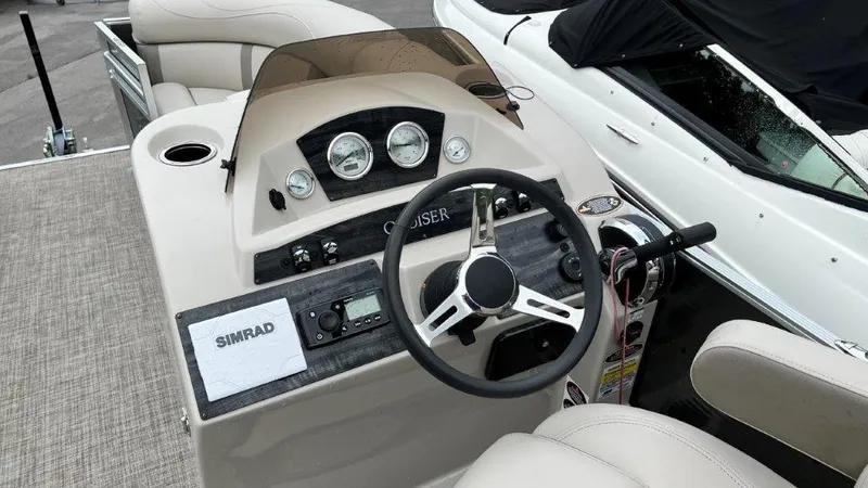 Slide: The Image of Cockpit of 2020 Harris FloteBote 210 CX Cruiser with steering wheel and gauges. - 4