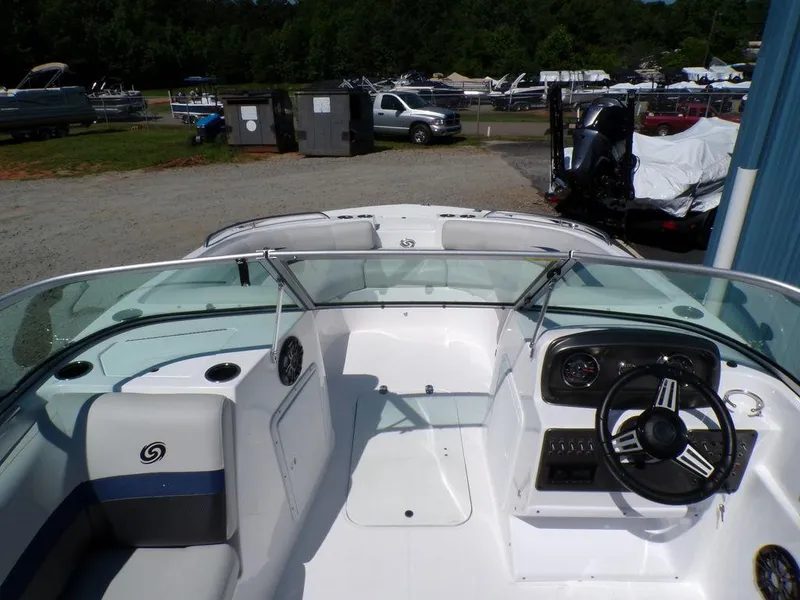 Slide: The Image of 2023 Hurricane SunDeck 187 OB boat interior with steering wheel and seating. - 10
