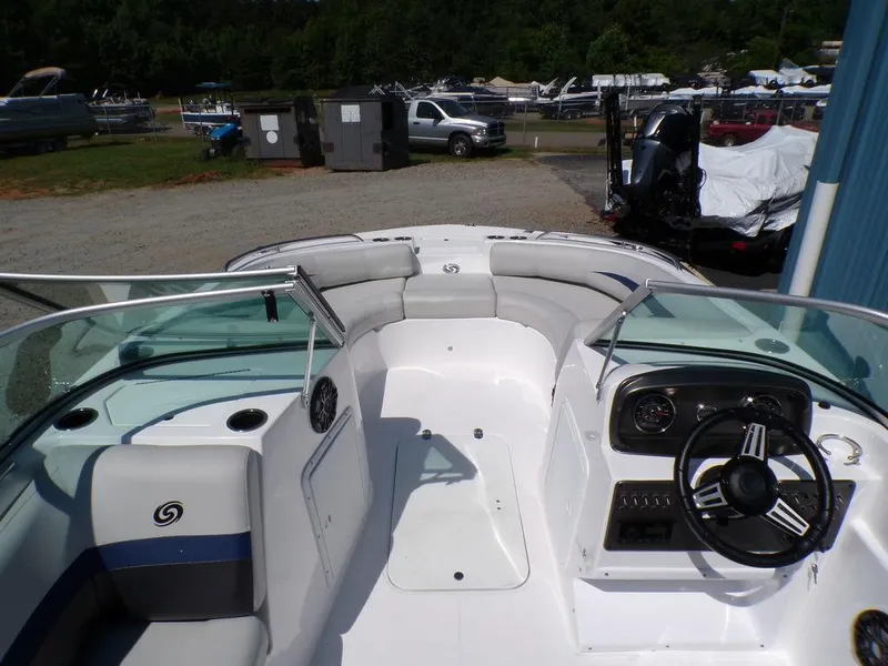 Slide: The Image of 2023 Hurricane SunDeck 187 OB boat interior with seating and steering console. - 12