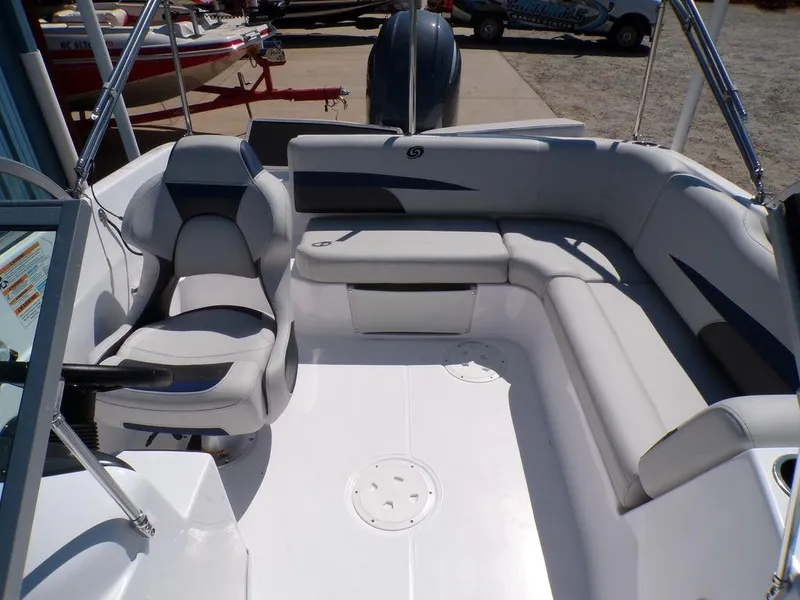 Slide: The Image of 2023 Hurricane SunDeck 187 OB boat interior with seating and helm chair. - 16