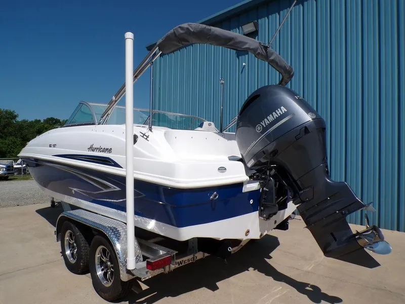 Slide: The Image of 2023 Hurricane SunDeck 187 OB boat with Yamaha outboard motor on trailer. - 3