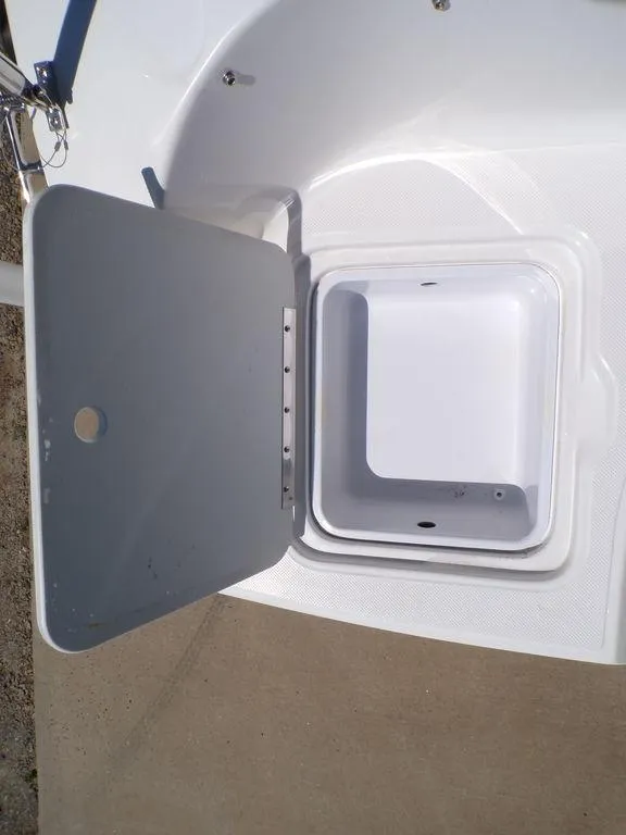 Slide: The Image of 2023 Hurricane SunDeck 187 OB storage compartment with open hatch. - 38